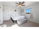 Bright bedroom with a comfortable bed and ceiling fan at 2008 W Campbell Ave, Phoenix, AZ 85015