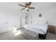 Main bedroom with plush bedding and ceiling fan at 2008 W Campbell Ave, Phoenix, AZ 85015