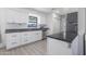 Updated kitchen with white cabinets and dark countertops at 2008 W Campbell Ave, Phoenix, AZ 85015