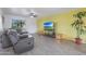 Bright living room with gray sectional sofa and large TV at 2008 W Campbell Ave, Phoenix, AZ 85015