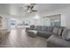 Open living area with gray sectional and kitchen view at 2008 W Campbell Ave, Phoenix, AZ 85015