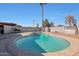 Inviting kidney-shaped pool with a large surrounding patio at 2008 W Campbell Ave, Phoenix, AZ 85015