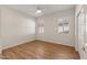 Bright bedroom with wood flooring and plantation shutters at 20533 N Sequoia Crest Dr, Surprise, AZ 85387