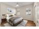 Charming bedroom, featuring wood flooring and stylish decor at 20533 N Sequoia Crest Dr, Surprise, AZ 85387