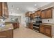 Modern kitchen featuring granite countertops and ample wood cabinetry at 20533 N Sequoia Crest Dr, Surprise, AZ 85387