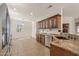 Kitchen with dark wood cabinets, granite countertops, and stainless steel appliances at 20533 N Sequoia Crest Dr, Surprise, AZ 85387