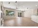 Bright living room with tile floors, sliding glass doors, and ceiling fan at 20533 N Sequoia Crest Dr, Surprise, AZ 85387