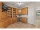 Spacious home office, featuring built-in wooden shelving and a corner desk at 20533 N Sequoia Crest Dr, Surprise, AZ 85387