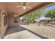 Covered patio with ceiling fans and backyard access at 20533 N Sequoia Crest Dr, Surprise, AZ 85387