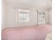 Dining room with pink carpet and sliding glass doors at 20811 N 148Th Dr, Sun City West, AZ 85375