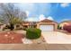 House exterior with a white garage door and well-maintained landscaping at 20811 N 148Th Dr, Sun City West, AZ 85375