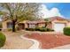 Single-story house with landscaped yard and two-car garage at 20811 N 148Th Dr, Sun City West, AZ 85375