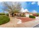 Single-story house with landscaped yard and two-car garage at 20811 N 148Th Dr, Sun City West, AZ 85375