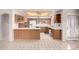 View of kitchen with wood cabinets and appliances at 20811 N 148Th Dr, Sun City West, AZ 85375