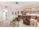 Bright living room with two comfy armchairs and a glass-top coffee table at 20811 N 148Th Dr, Sun City West, AZ 85375