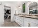 Elegant bathroom with double vanity, granite countertop, and walk-in shower at 21054 N 74Th Ln, Glendale, AZ 85308