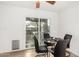 Small dining area with a round glass table and four black chairs at 21054 N 74Th Ln, Glendale, AZ 85308