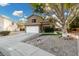 Two-story house with landscaped yard, driveway, and white garage door at 21054 N 74Th Ln, Glendale, AZ 85308