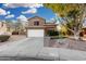 Two-story house with landscaped yard, driveway, and white garage door at 21054 N 74Th Ln, Glendale, AZ 85308