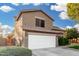 Two-story house with landscaped yard, driveway, and white garage door at 21054 N 74Th Ln, Glendale, AZ 85308