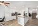 Modern kitchen featuring white cabinets, granite countertops, and stainless steel appliances at 21054 N 74Th Ln, Glendale, AZ 85308