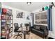 Home office with built-in shelving, a desk, and comfortable seating at 21054 N 74Th Ln, Glendale, AZ 85308