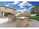 Luxury outdoor kitchen with stainless steel appliances at 21054 N 74Th Ln, Glendale, AZ 85308