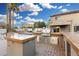 Outdoor kitchen and pool area with luxurious features at 21054 N 74Th Ln, Glendale, AZ 85308