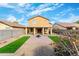 Landscaped backyard with patio and fire pit at 2119 W Vineyard Plains Dr, San Tan Valley, AZ 85144