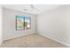 Well-lit bedroom featuring carpet and a window at 2119 W Vineyard Plains Dr, San Tan Valley, AZ 85144