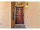 Front door with a security door and a light fixture at 2119 W Vineyard Plains Dr, San Tan Valley, AZ 85144