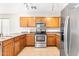 Kitchen with stainless steel appliances and wood cabinets at 2119 W Vineyard Plains Dr, San Tan Valley, AZ 85144