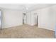 Main bedroom with carpet, ceiling fan, and access to the hallway at 2119 W Vineyard Plains Dr, San Tan Valley, AZ 85144