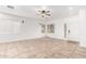 Bright living room with tile floors and ceiling fan at 21362 E Puesta Del Sol Rd, Queen Creek, AZ 85142