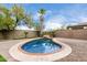 Relaxing kidney-shaped pool with a waterfall feature at 21362 E Puesta Del Sol Rd, Queen Creek, AZ 85142