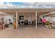 Covered patio with fireplace and seating area, adjacent to backyard at 2206 W Glendale Ave, Phoenix, AZ 85021