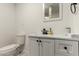 Clean bathroom with a white vanity and modern fixtures at 2206 W Glendale Ave, Phoenix, AZ 85021