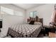 Cozy bedroom featuring a full-size bed and wood headboard at 2206 W Glendale Ave, Phoenix, AZ 85021