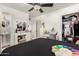 Bedroom with queen bed, dresser, and walk-in closet at 2206 W Glendale Ave, Phoenix, AZ 85021