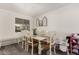 Farmhouse style dining room with white table and chairs at 2206 W Glendale Ave, Phoenix, AZ 85021