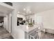 Modern kitchen with white cabinets, quartz countertops, and stainless steel appliances at 2206 W Glendale Ave, Phoenix, AZ 85021