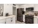 Updated kitchen featuring stainless steel appliances and white shaker cabinets at 2206 W Glendale Ave, Phoenix, AZ 85021