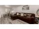 Living room with L-shaped sofa and dining area view at 2206 W Glendale Ave, Phoenix, AZ 85021