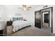 Bedroom with dresser and ensuite access at 2238 S Estrella Cir, Mesa, AZ 85202