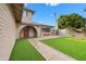 Landscaped front yard with artificial turf and walkway at 2238 S Estrella Cir, Mesa, AZ 85202