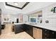 Modern kitchen with island, stainless steel appliances, and white cabinets at 2238 S Estrella Cir, Mesa, AZ 85202