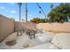 Concrete patio with fire pit and seating area at 2238 S Estrella Cir, Mesa, AZ 85202