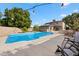 Relaxing pool area with lounge chairs and string lights at 2238 S Estrella Cir, Mesa, AZ 85202