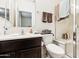 Bathroom with walk-in shower and dark wood vanity at 22402 W Harrison St, Buckeye, AZ 85326