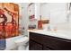 Bathroom with shower/tub combo and dark wood vanity at 22402 W Harrison St, Buckeye, AZ 85326